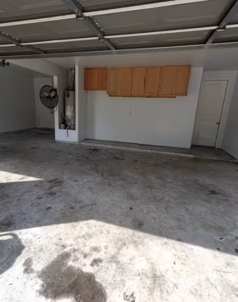 Bare concrete garage floor before epoxy flake coating
