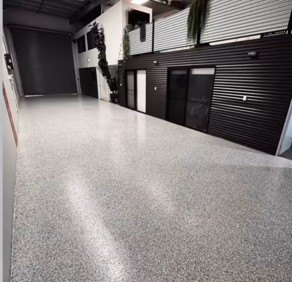 Flake epoxy floor coating detail showing chip broadcast